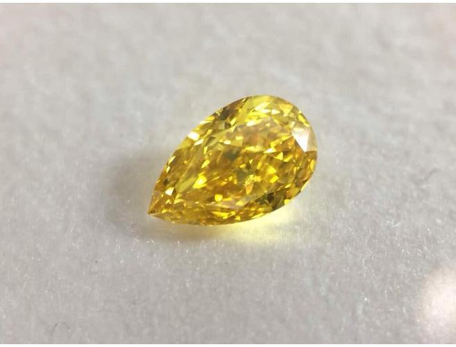 Pear, 0.80 Carat, Fancy Vivid Yellow, VS1, Natural Loose Diamond.